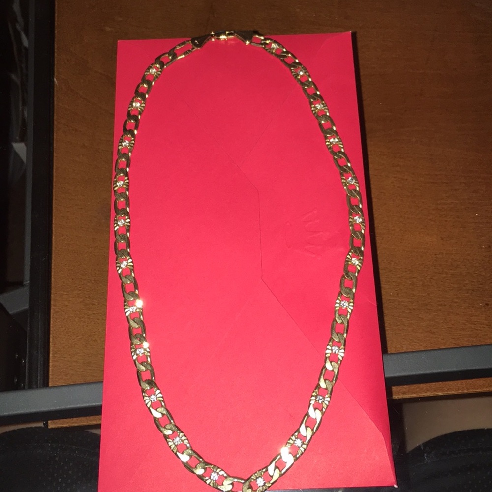 14k necklace with diamonds in the middle.